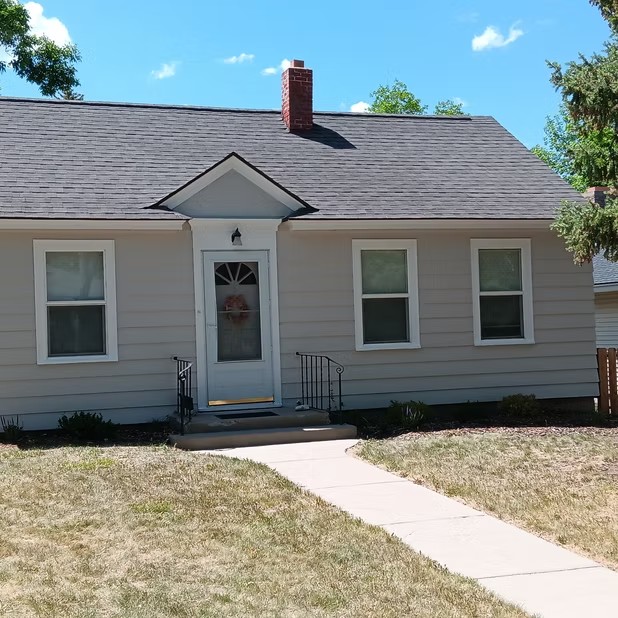 Light siding and white front door