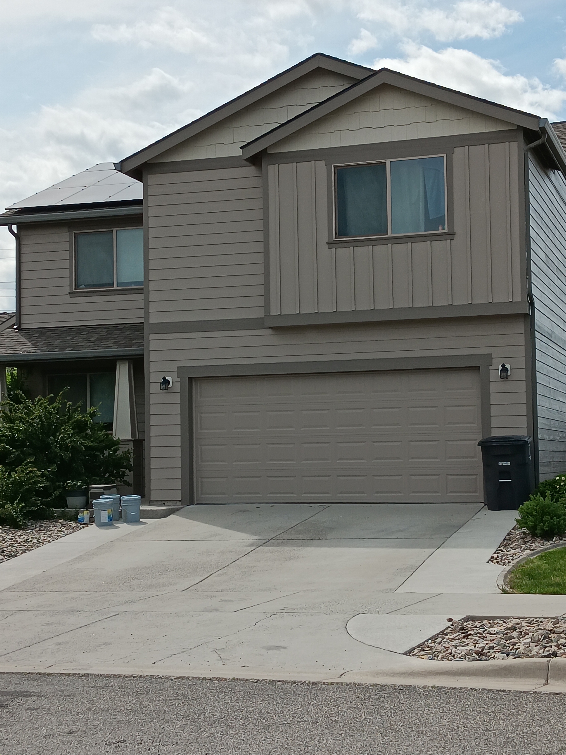 Taupe home with attached garage from Davy Montana Painting’s gallery